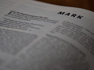 a close up of an open book with the word mark on it