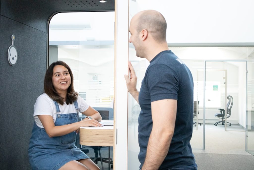 a man and a woman sitting in front of a mirror