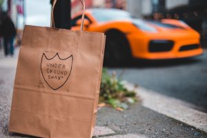 brown paper bag on gray concrete floor