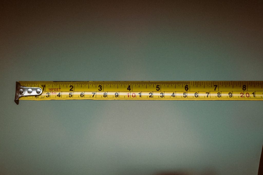 a person holding a tape measure in their hand