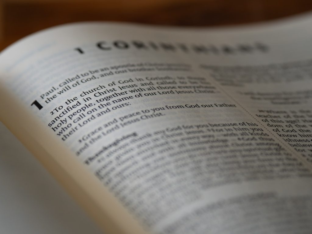 An open book sitting on top of a wooden table