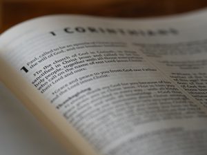 An open book sitting on top of a wooden table