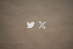 a close up of a piece of paper with a twitter logo on it